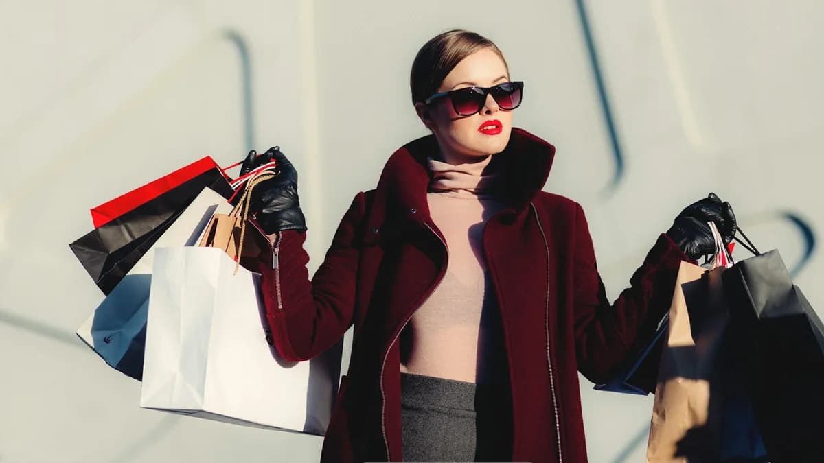 Woman browsing clothes on a rack - virtual try-on and previewing outfits before buying online
