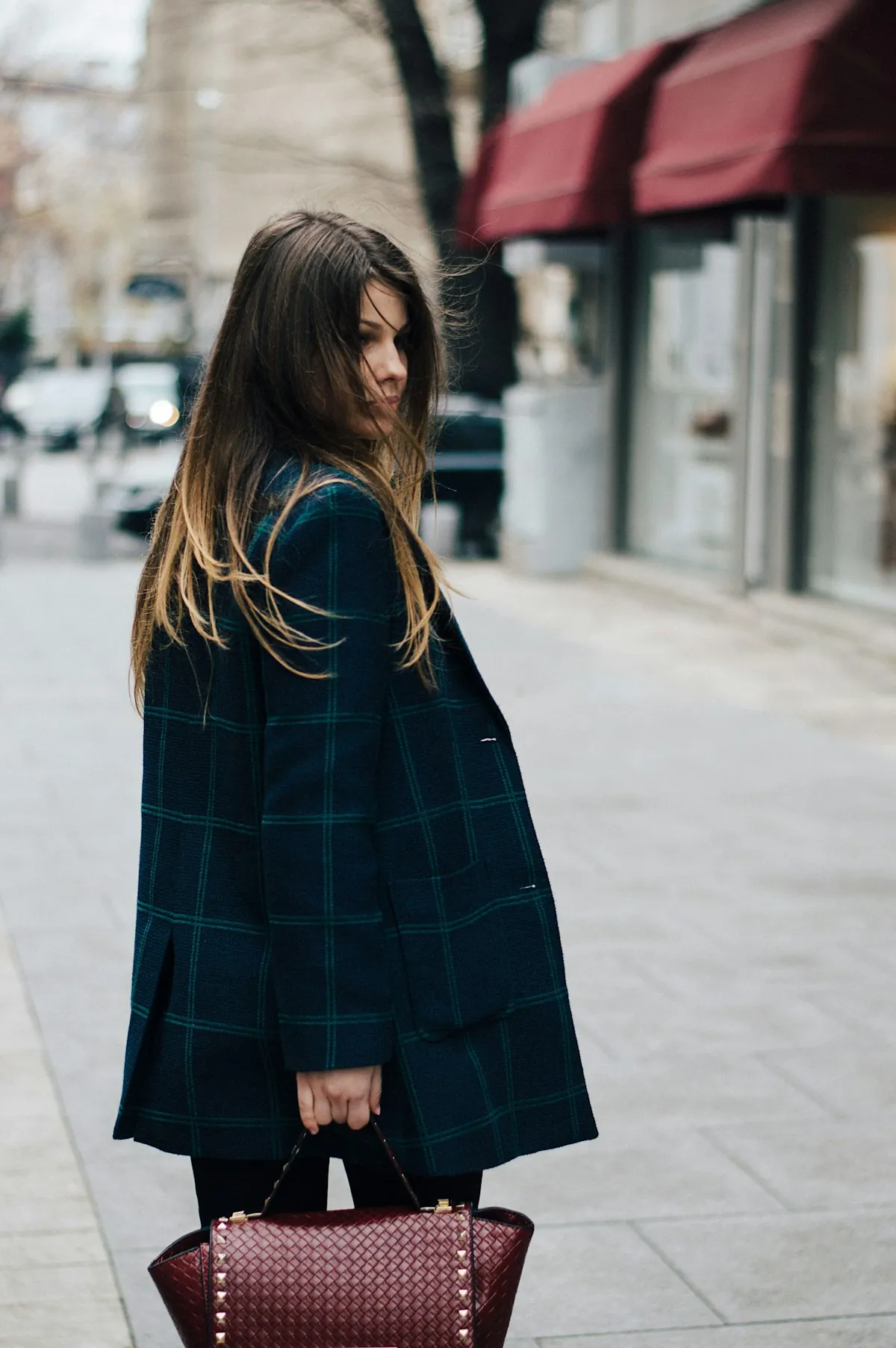 Editorial virtual try-on image generated by an AI commerce agent for a styling client